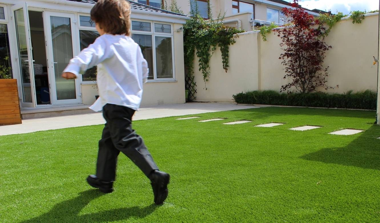 Say Goodbye to Lawn Maintenance: Transform Your Backyard with Synthetic Turf in Red Deer